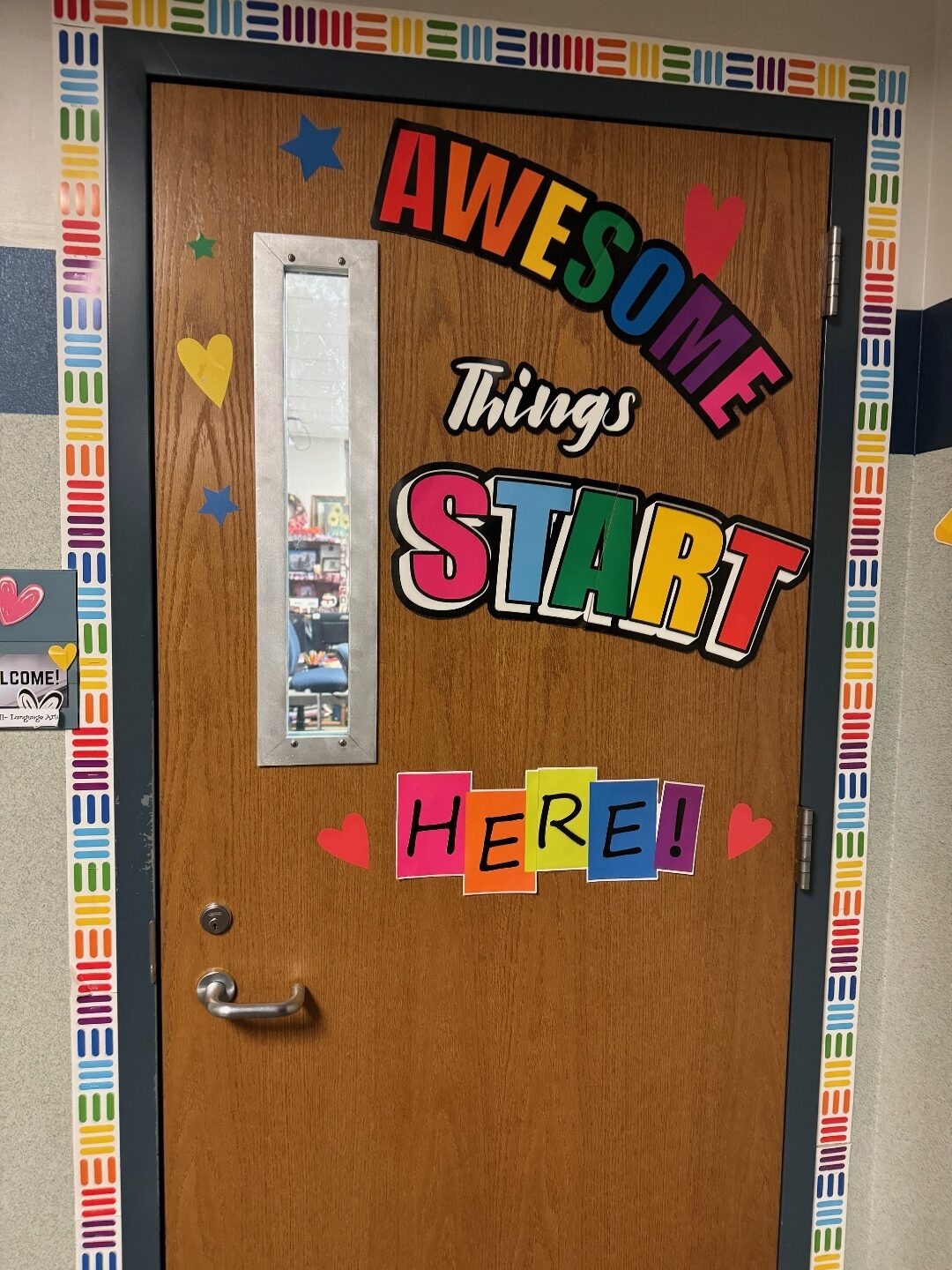 RetroKIT installed in a narrow 25 by 4 inch classroom door vision lite at an Indiana high school. Door is decorated with student-made signage that reads Awesome things start here.