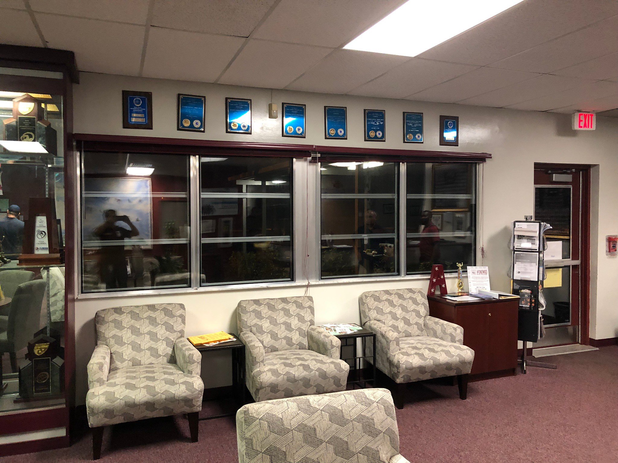 Reception area at Marjory Stoneman Douglas High School in Parkland, FL, with BallistiMAX transaction-window glazing installed behind the front counter.